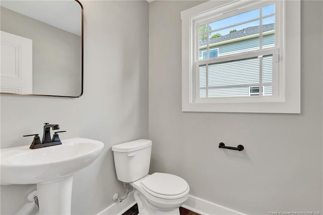 4037 Fulford Mcmillan Rd, Raeford, NC 28376 - half bathroom featuring toilet, a sink, and baseboards