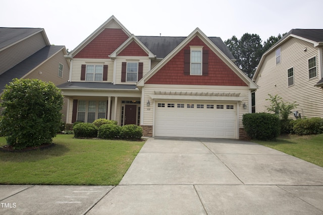 309 Forest Haven Dr, Holly Springs, NC 27540 - craftsman inspired home featuring concrete driveway, a front lawn, an attached garage, and stone siding