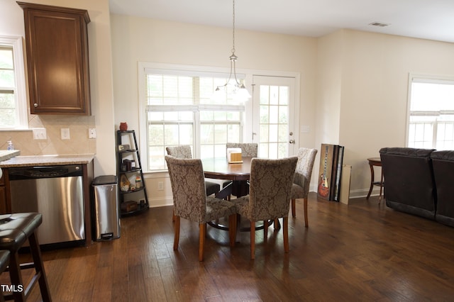 309 Forest Haven Dr, Holly Springs, NC 27540 - dining room with dark wood-style flooring, plenty of natural light, and a chandelier