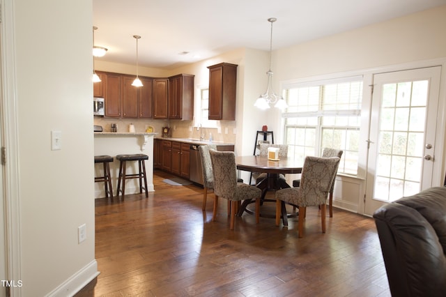 309 Forest Haven Dr, Holly Springs, NC 27540 - dining room featuring dark wood finished floors and baseboards