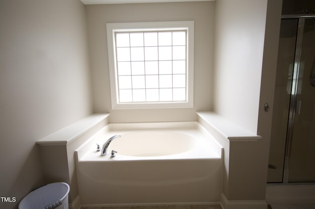 309 Forest Haven Dr, Holly Springs, NC 27540 - bathroom with a stall shower, a garden tub, and toilet