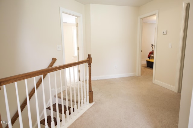 309 Forest Haven Dr, Holly Springs, NC 27540 - hall with an upstairs landing, light colored carpet, and baseboards