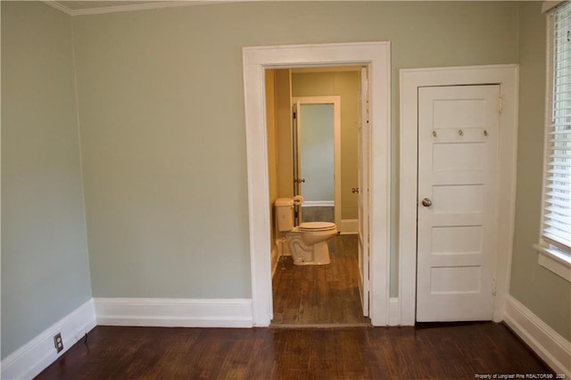211 Sedberry St, Fayetteville, NC 28305 - unfurnished bedroom with dark wood finished floors, baseboards, ornamental molding, and ensuite bathroom