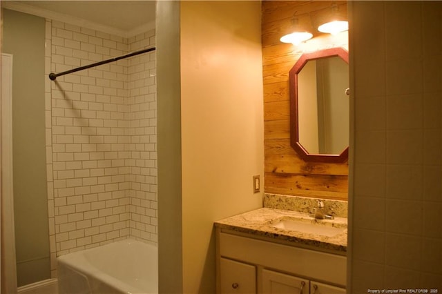 211 Sedberry St, Fayetteville, NC 28305 - bathroom with wood walls, vanity, crown molding, and shower / washtub combination