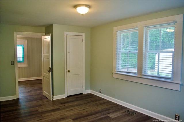 211 Sedberry St, Fayetteville, NC 28305 - empty room with baseboards, plenty of natural light, and dark wood finished floors