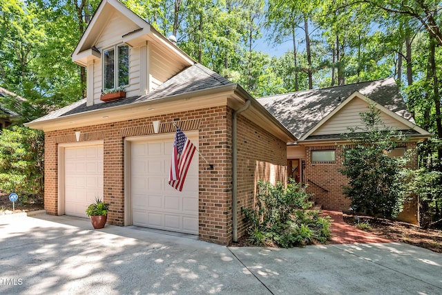 81106 Alexander, Chapel Hill, NC 27517 - view of side of property with brick siding, driveway, and a shingled roof