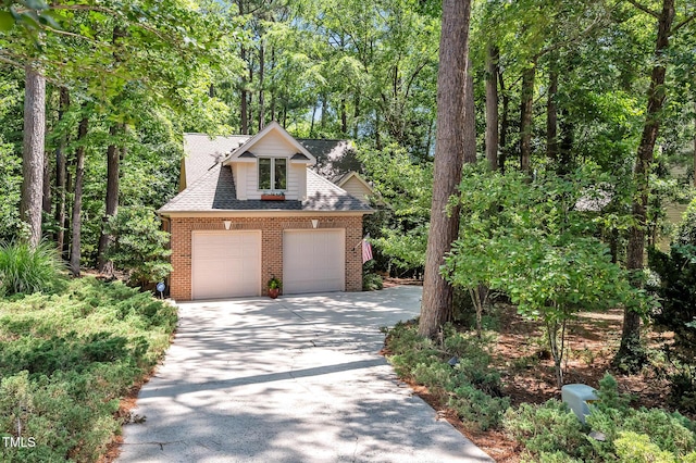 81106 Alexander, Chapel Hill, NC 27517 - view of front of property with brick siding, a garage, concrete driveway, and roof with shingles