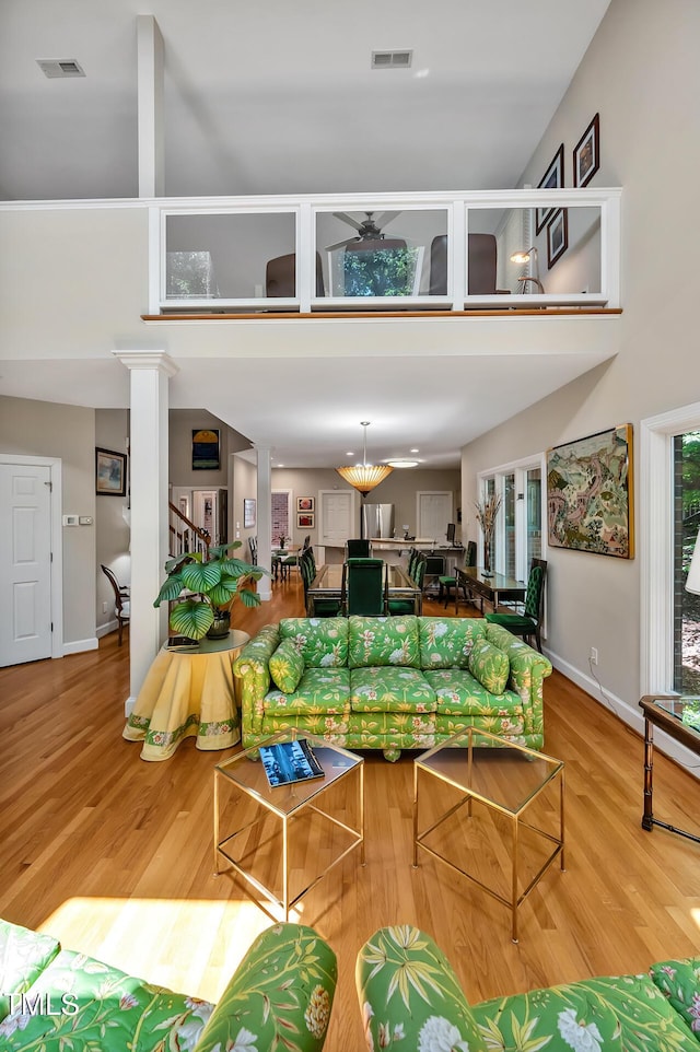 81106 Alexander, Chapel Hill, NC 27517 - living area featuring wood finished floors, a towering ceiling, and stairway