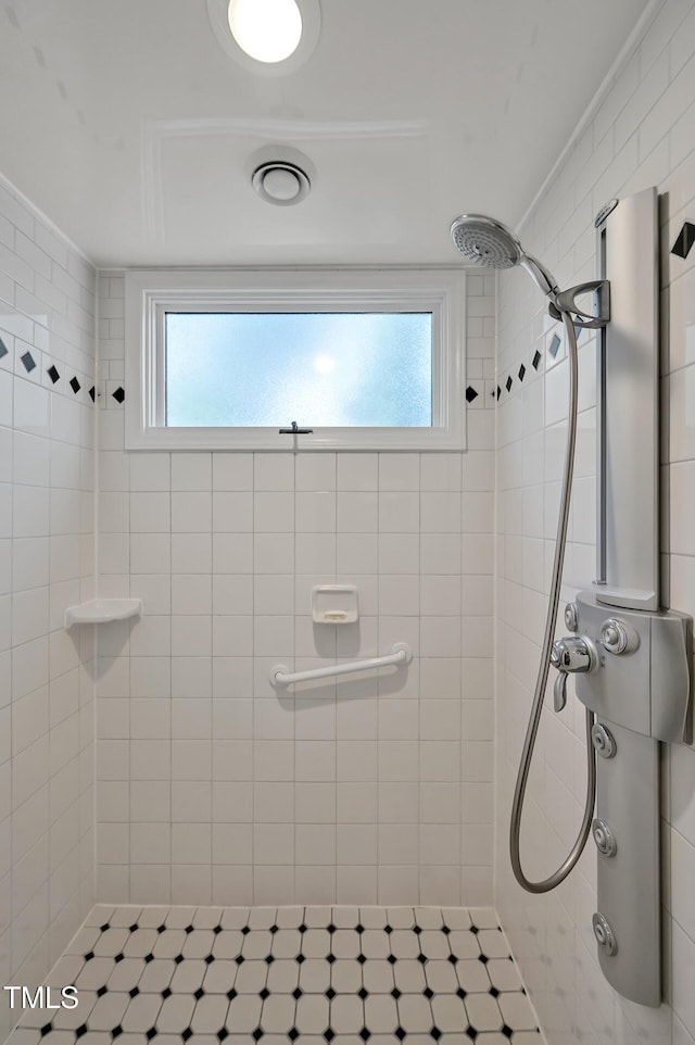 81106 Alexander, Chapel Hill, NC 27517 - bathroom featuring tiled shower and healthy amount of natural light