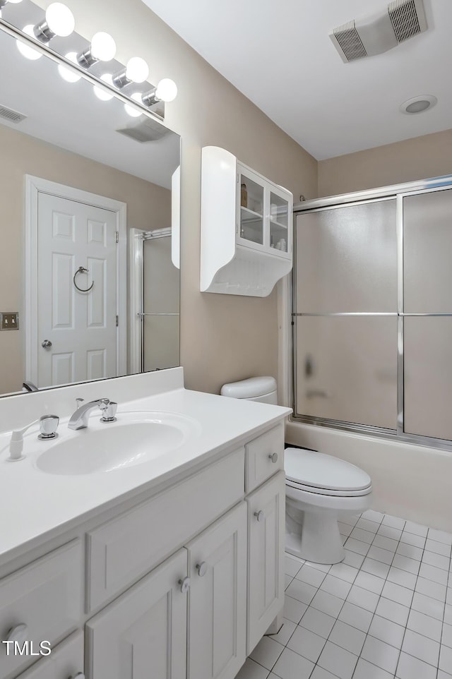 81106 Alexander, Chapel Hill, NC 27517 - bathroom with vanity, tile patterned flooring, and bath / shower combo with glass door