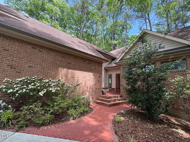 81106 Alexander, Chapel Hill, NC 27517 - entrance to property with brick siding and a shingled roof