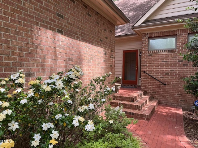81106 Alexander, Chapel Hill, NC 27517 - property entrance with roof with shingles and brick siding