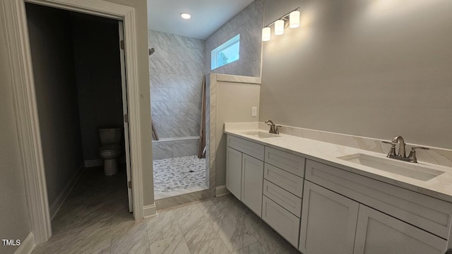 109 Drew St, Louisburg, NC 27549 - full bath with a tile shower, toilet, double vanity, and baseboards