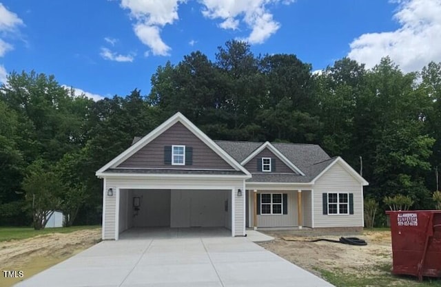 109 Drew St, Louisburg, NC 27549 - view of front of home with driveway and a porch