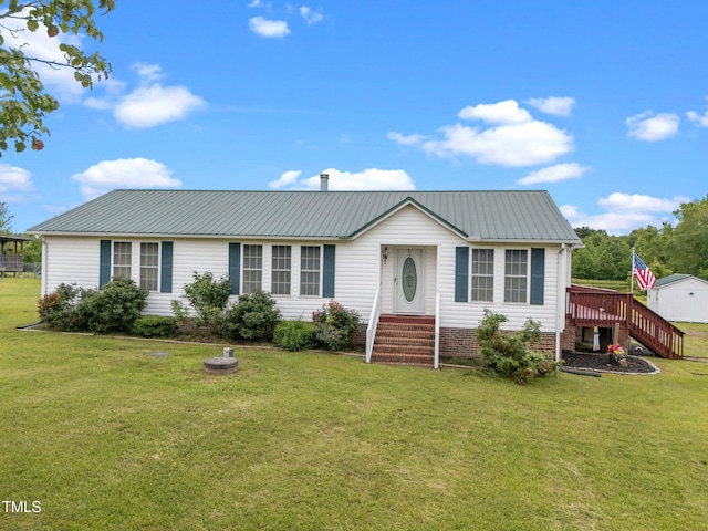 1993 Lucy Garrett Rd, Roxboro, NC 27574 - view of front facade featuring metal roof, a front lawn, a wooden deck, and stairs
