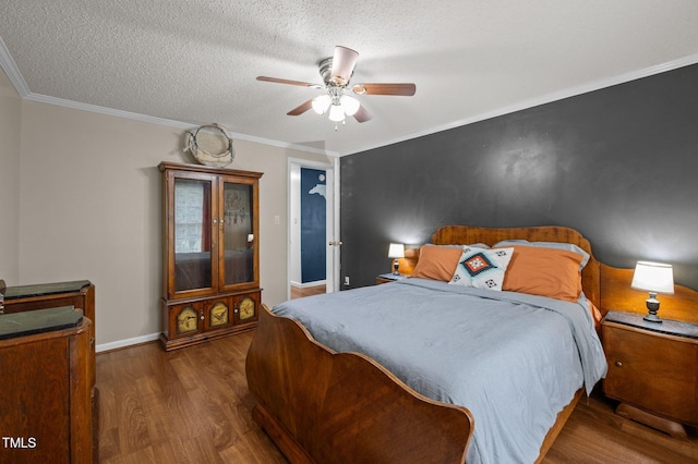 1993 Lucy Garrett Rd, Roxboro, NC 27574 - bedroom with wood finished floors, a textured ceiling, ornamental molding, a ceiling fan, and baseboards