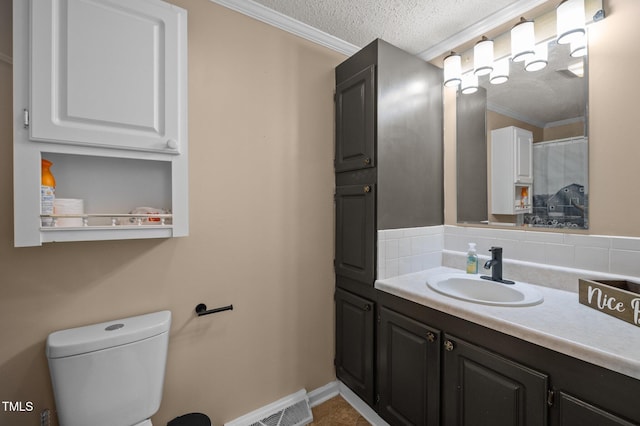 1993 Lucy Garrett Rd, Roxboro, NC 27574 - full bathroom with a textured ceiling, vanity, ornamental molding, toilet, and baseboards