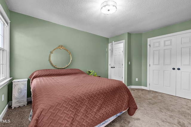 1 Gatesway Ct, Durham, NC 27707 - carpeted bedroom with a textured ceiling and a closet