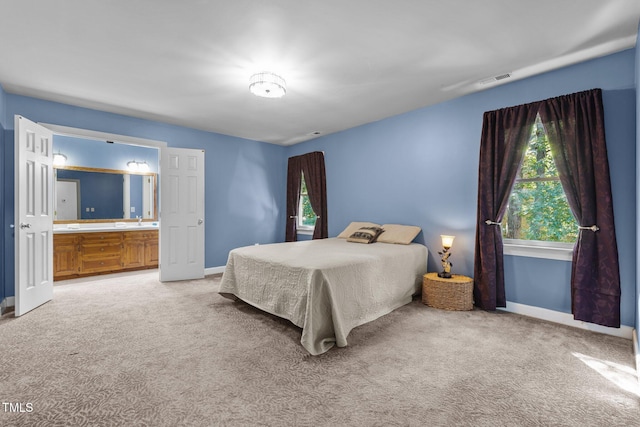1 Gatesway Ct, Durham, NC 27707 - bedroom featuring light colored carpet and ensuite bathroom
