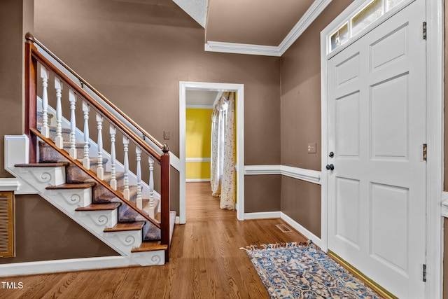 1 Gatesway Ct, Durham, NC 27707 - foyer entrance featuring crown molding, wood finished floors, and stairway