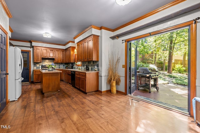 1 Gatesway Ct, Durham, NC 27707 - kitchen featuring freestanding refrigerator, dishwasher, dark wood-style floors, light countertops, and a center island