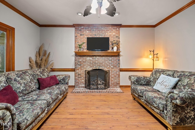 1 Gatesway Ct, Durham, NC 27707 - living room with wood finished floors, a ceiling fan, a fireplace, and ornamental molding