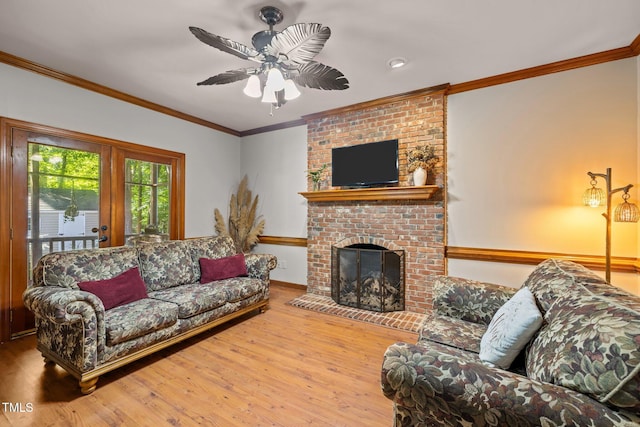 1 Gatesway Ct, Durham, NC 27707 - living room with wood finished floors, ceiling fan, a fireplace, and crown molding