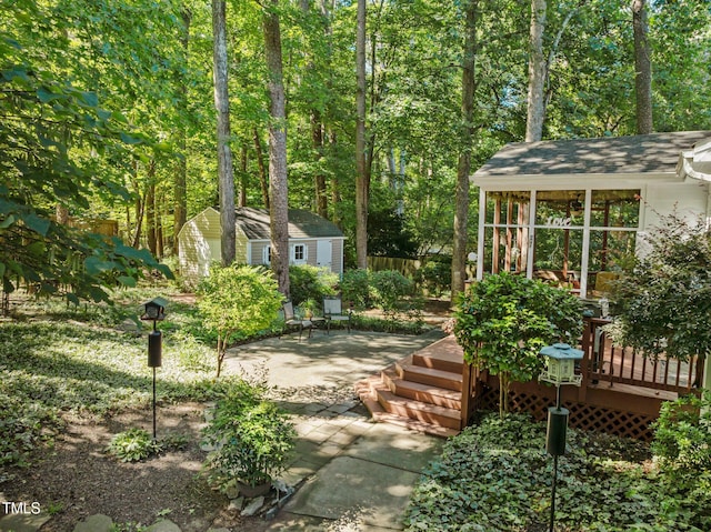 1 Gatesway Ct, Durham, NC 27707 - view of yard with a storage unit, a wooden deck, and a patio