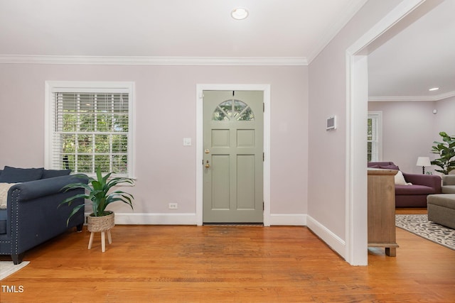 821 Onslow St, Durham, NC 27705 - entrance foyer featuring light wood-style floors, ornamental molding, and recessed lighting