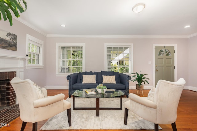 821 Onslow St, Durham, NC 27705 - living area featuring healthy amount of natural light, wood finished floors, crown molding, a fireplace, and recessed lighting
