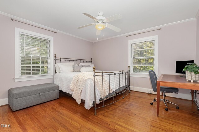 821 Onslow St, Durham, NC 27705 - bedroom with wood finished floors, ornamental molding, a desk, and ceiling fan
