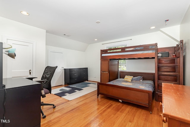 821 Onslow St, Durham, NC 27705 - bedroom with wood finished floors, lofted ceiling, a desk, and recessed lighting
