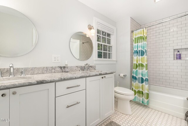 821 Onslow St, Durham, NC 27705 - bathroom with double vanity and shower / tub combo