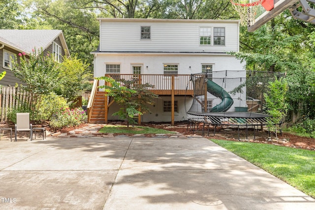 821 Onslow St, Durham, NC 27705 - rear view of property featuring stairs, a wooden deck, a patio, and a trampoline
