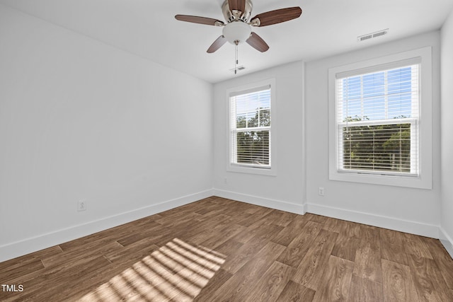531 N Person St Unit 205, Raleigh, NC 27604 - empty room with baseboards, wood finished floors, and a ceiling fan