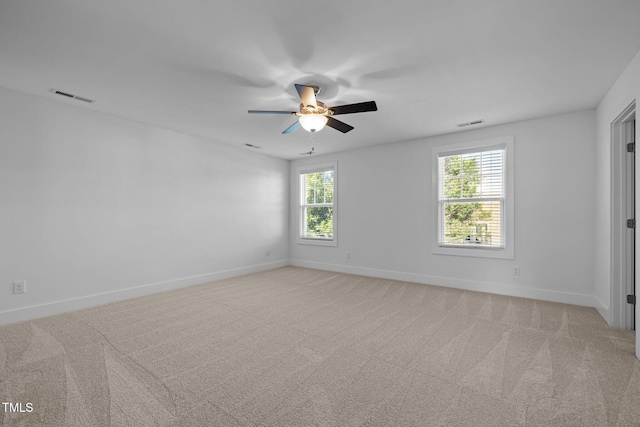 531 N Person St Unit 205, Raleigh, NC 27604 - unfurnished room featuring a ceiling fan, baseboards, and light carpet