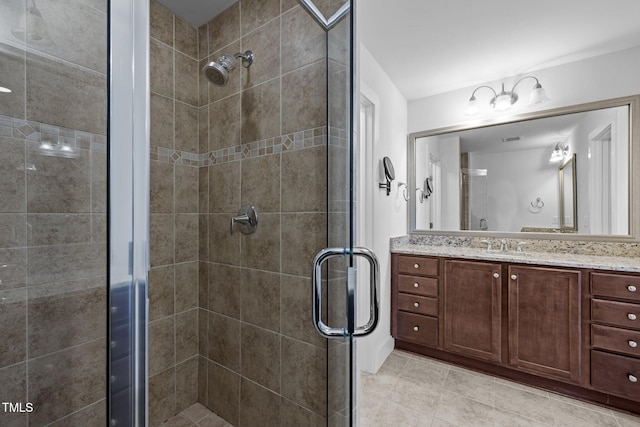 531 N Person St Unit 205, Raleigh, NC 27604 - bathroom featuring a stall shower, vanity, and tile patterned flooring