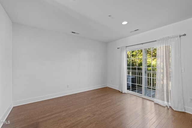 531 N Person St Unit 205, Raleigh, NC 27604 - unfurnished room featuring wood finished floors, baseboards, and recessed lighting