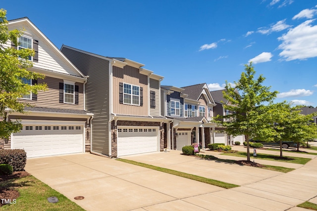 512 Barneswyck Dr, Fuquay Varina, NC 27526 - view of front of house with an attached garage, concrete driveway, and stone siding