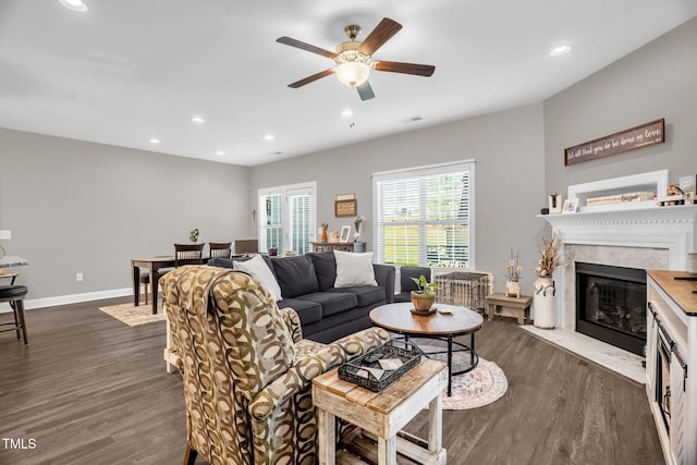 512 Barneswyck Dr, Fuquay Varina, NC 27526 - living area with dark wood-type flooring, a ceiling fan, a high end fireplace, recessed lighting, and baseboards