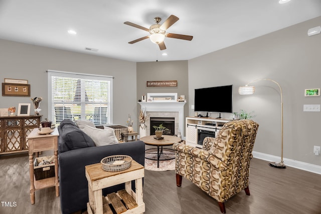 512 Barneswyck Dr, Fuquay Varina, NC 27526 - living area featuring a ceiling fan, dark wood finished floors, baseboards, a glass covered fireplace, and recessed lighting