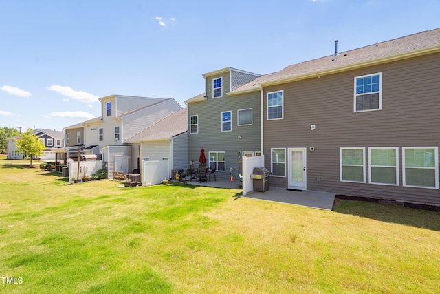 512 Barneswyck Dr, Fuquay Varina, NC 27526 - back of property featuring a patio area and a lawn