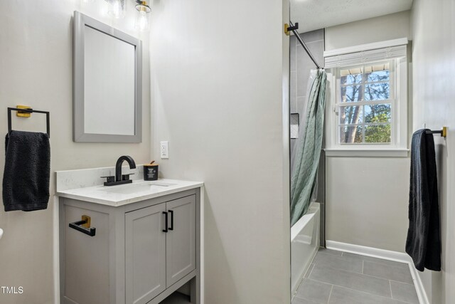1841 Conover Dr, Fayetteville, NC 28304 - full bathroom featuring vanity, shower / tub combo, tile patterned flooring, and baseboards
