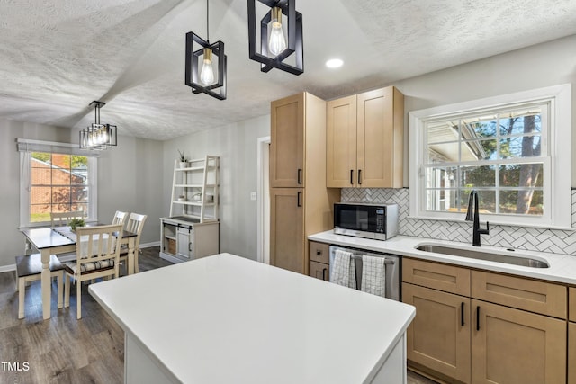 1841 Conover Dr, Fayetteville, NC 28304 - kitchen with a sink, dark wood-style flooring, stainless steel dishwasher, backsplash, and light countertops