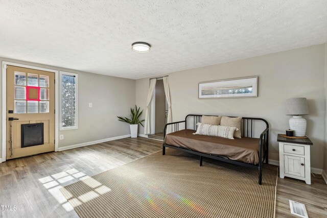 1841 Conover Dr, Fayetteville, NC 28304 - bedroom with wood finished floors, baseboards, and a textured ceiling