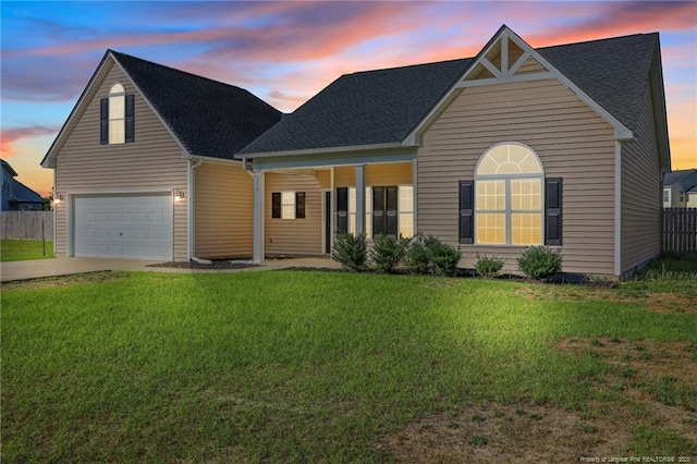 254 Blackhawk Ln, Raeford, NC 28376 - traditional home featuring an attached garage, driveway, and a shingled roof