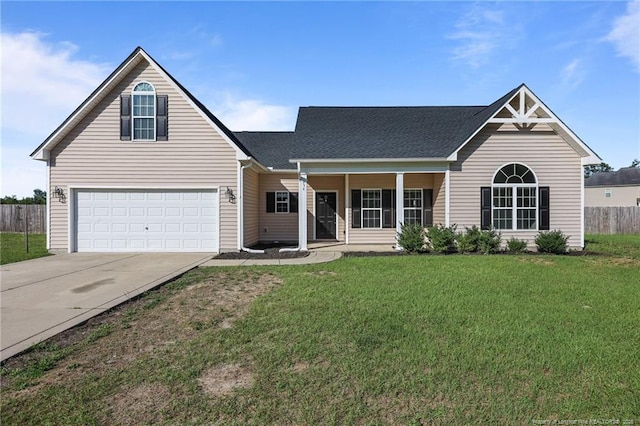254 Blackhawk Ln, Raeford, NC 28376 - traditional-style home featuring concrete driveway, a porch, an attached garage, and a shingled roof