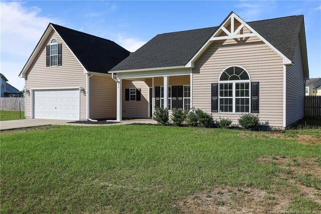 254 Blackhawk Ln, Raeford, NC 28376 - traditional home with concrete driveway, roof with shingles, and an attached garage