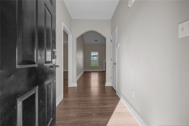 254 Blackhawk Ln, Raeford, NC 28376 - hall with arched walkways, dark wood-style flooring, and baseboards