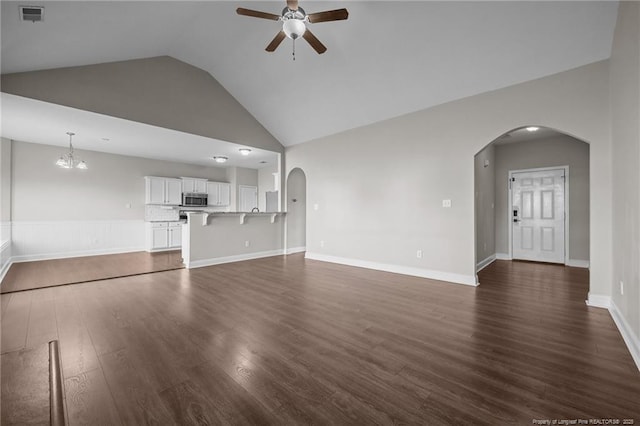 254 Blackhawk Ln, Raeford, NC 28376 - unfurnished living room featuring ceiling fan, arched walkways, dark wood-type flooring, and high vaulted ceiling